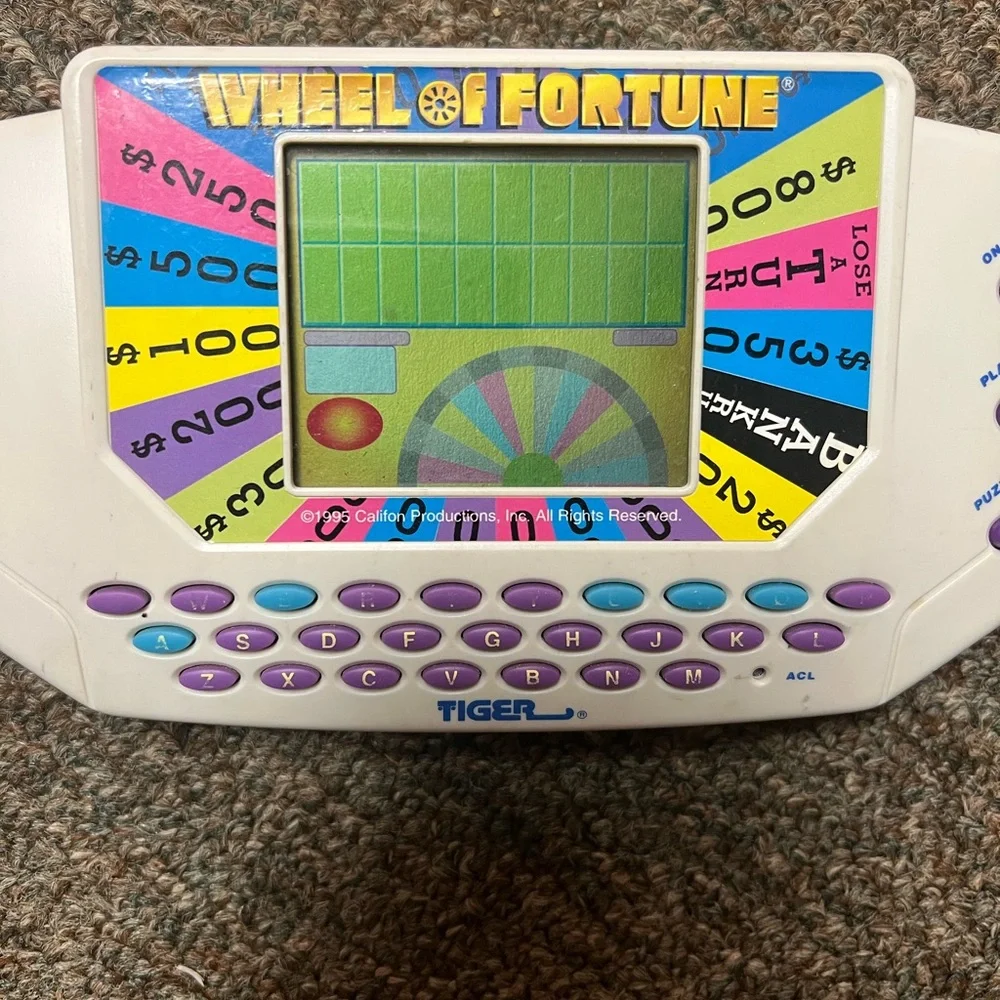 Tiger Electronics Wheel of Fortune Handheld Video Game - EUC